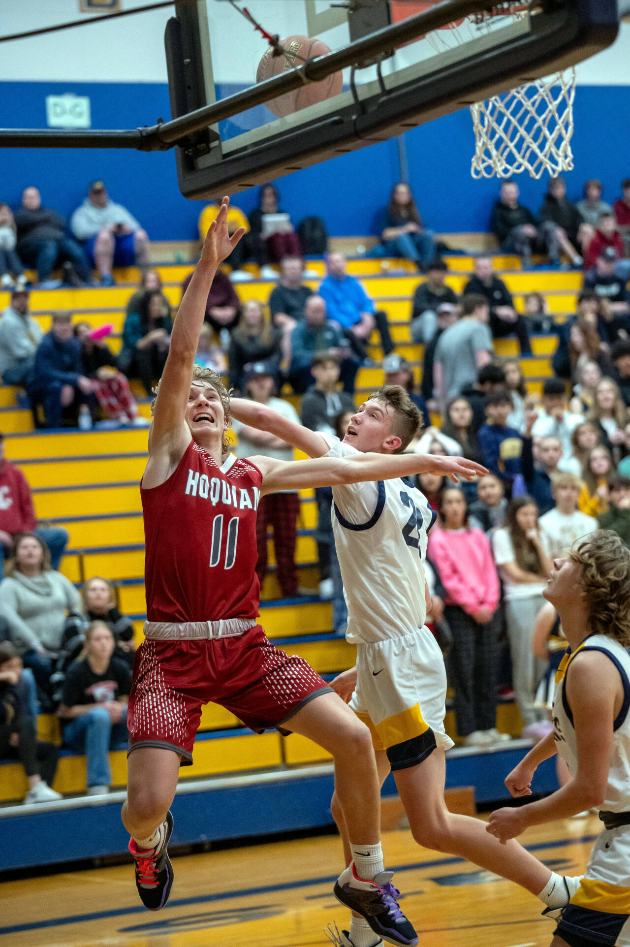 PHOTO BY FOREST WORGUM Hoquiam’s Zander Jump (11) scores two of his game-high 24 points while defended by Aberdeen’s Baylor Ainsworth in the Grizzlies’ 66-47 win on Monday at Sam Benn Gym in Aberdeen.