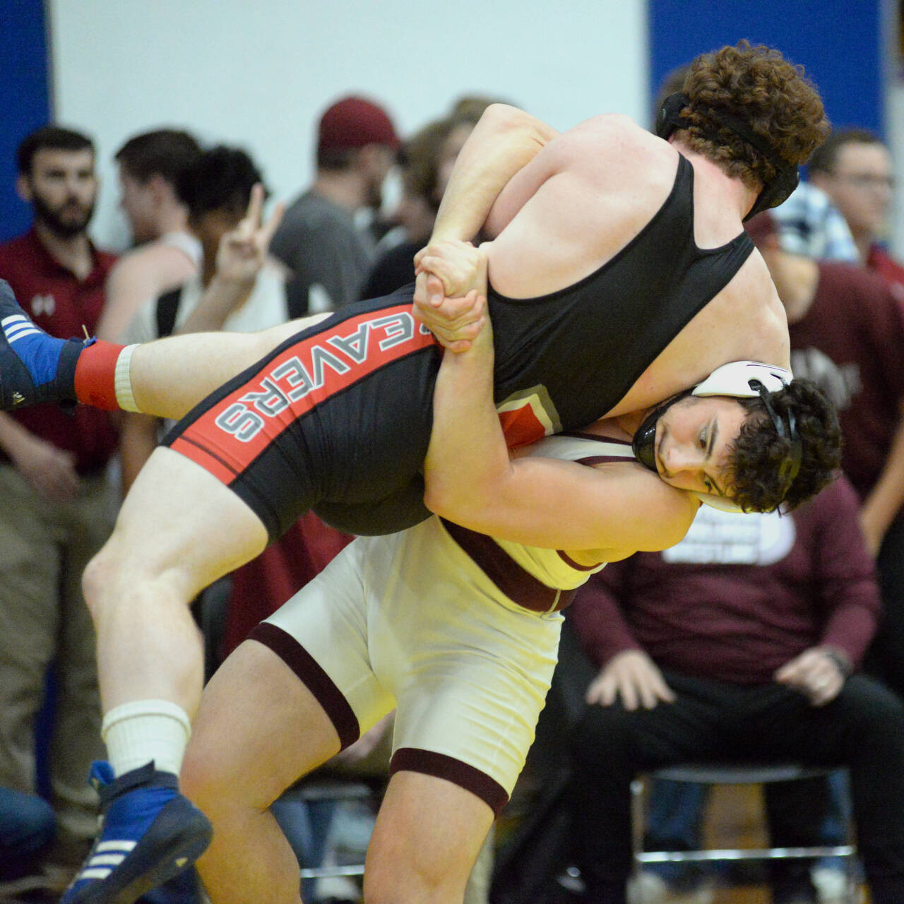 RYAN SPARKS | THE DAILY WORLD Montesano’s Mateo Sanchez, right, picks up Tenino’s Randy Marti during the 182-pound final of the Grays Harbor Championships on Saturday at Sam Benn Gym in Aberdeen.