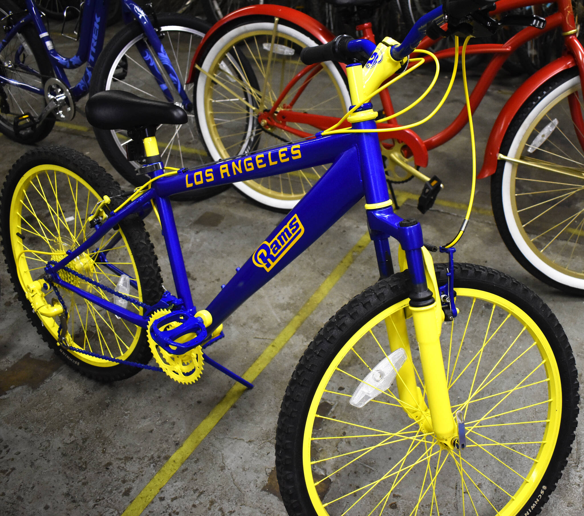 Matthew N. Wells / The Daily World 
This bike, painted the colors of the NFL’s Los Angeles Rams, was one of the many bicycles on Saturday afternoon that stood out to the Aberdeen Lions Club members and the parents who showed up to pick the bikes to gift their children and teens at Christmas. This bike shows one example of the craftsmanship and artistry that the inmates possess at Stafford Creek Corrections Center. The inmates fixed up the old bikes intended for children and teens. Kelly Peterson, corrections specialist at Stafford Creek Corrections Center’s Sustainable Prison Programs, said the inmates put a lot of pride and a lot of hard work into the process. “Because to them, it’s a form of redemption in the sense they’re giving back to the community,” Peterson said.
