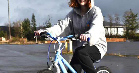 Matthew N. Wells / The Daily World 
Riley Gilbert, 14, received her first Christmas gift — a new bike — Saturday. Riley, who hasn’t had a new bike in a couple of years, rode her North Carolina Tar Heel-painted bike around as she and her mom, Kim, smiled. The bike is courtesy of the Aberdeen Lions Club’s program “Bicycles from Heaven,” which, after a simple application through the Salvation Army, provides children and teenagers bikes. Riley can’t wait to show hers off to her friends.