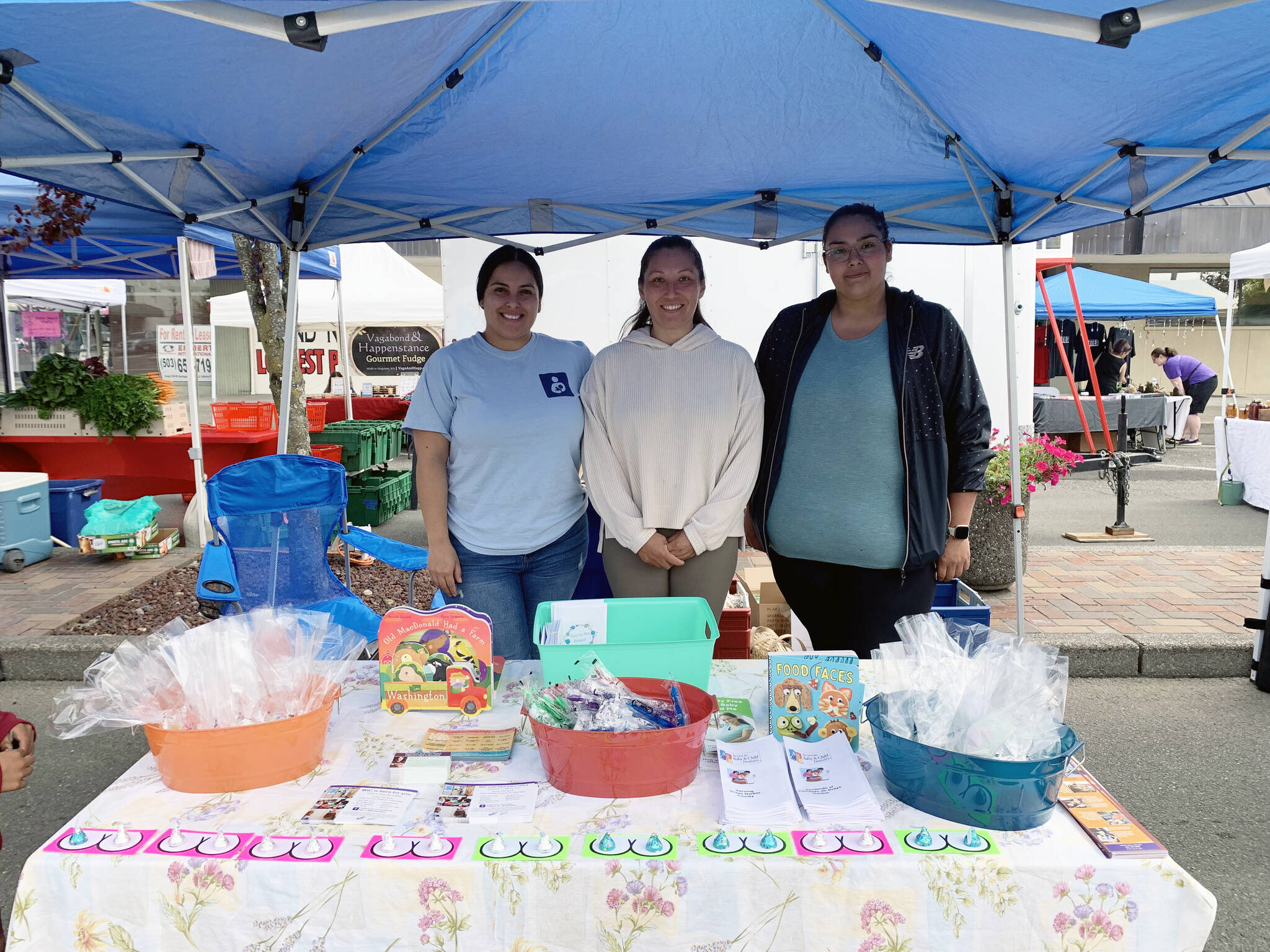 Grays Harbor County Public Health
From left: Talia Hernandez, Mina Fontenelle and Carmela Lopez pose as they celebrate World Breastfeeding Week in August at the Aberdeen Sunday Market.