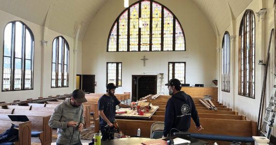 Matthew N. Wells / The Daily World 
Workers from Cathedral Crafts Stained Glass Company, out of Winona, Minnesota, work in order to complete the restoration of the 99-year-old stained glass windows at Amazing Grace Lutheran Church of Grays Harbor. The clear windows on the left side show the unfinished bits of restoration, which should be completed this week.
