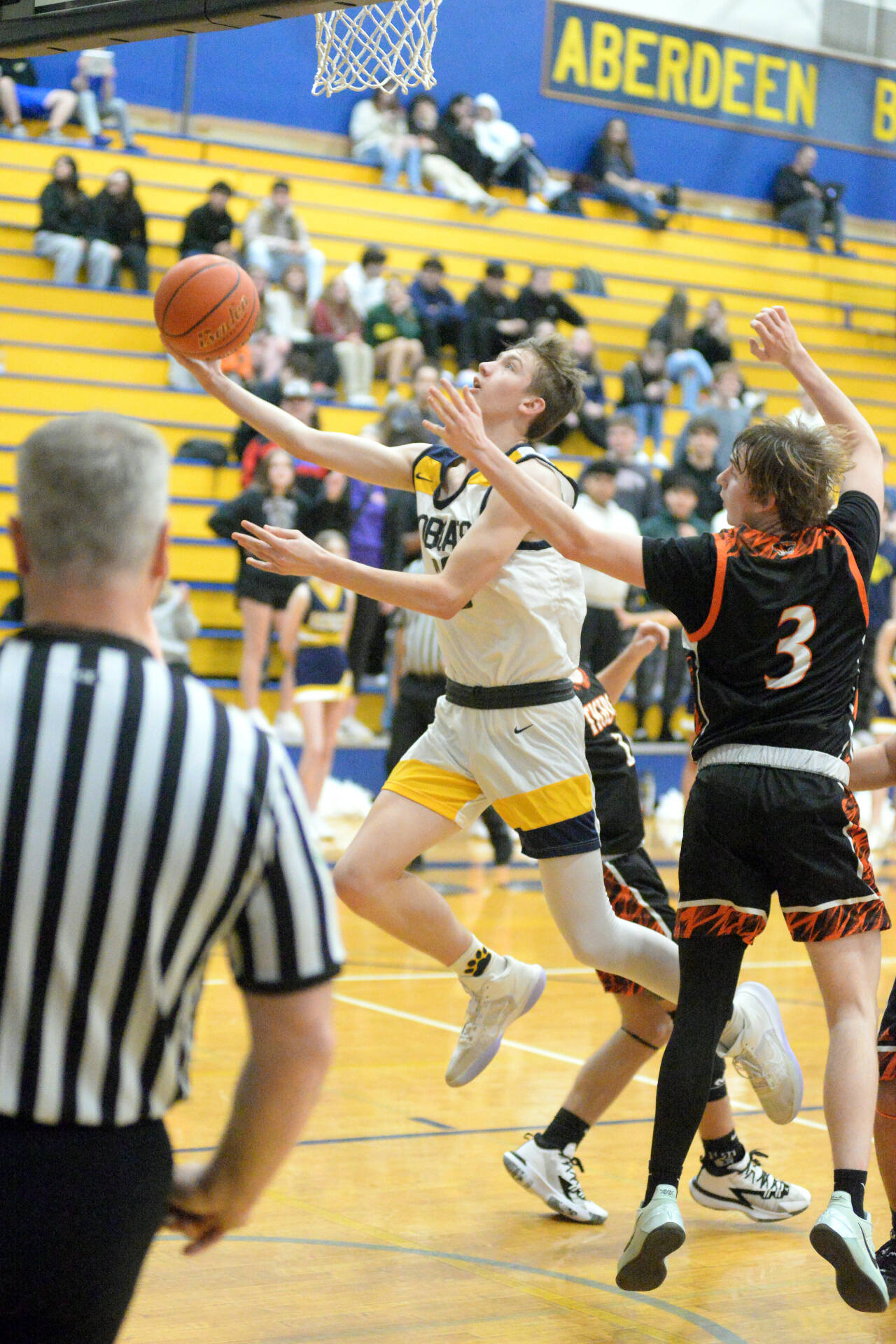 RYAN SPARKS / THE DAILY WORLD 
Aberdeen’s Baylor Ainsworth, left, scores two of his 10 first-half points in the Bobcats 50-49 win over Centralia on Tuesday in Aberdeen.