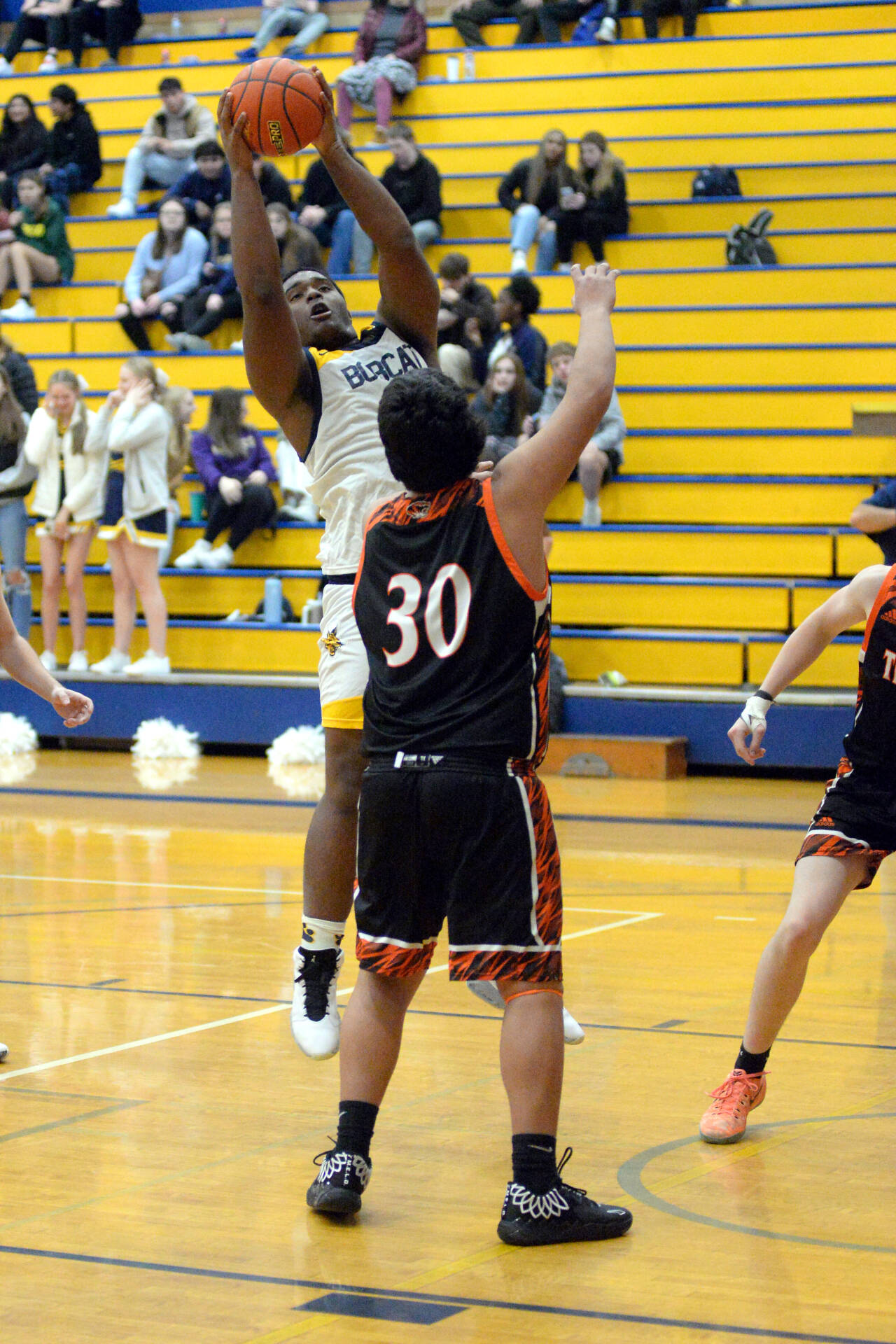 RYAN SPARKS / THE DAILY WORLD 
Aberdeen center Jabron Brooks, left, grabs a rebound over Centralia’s Carlos Vallejo (30) during the Bobcats’ 50-49 win on Tuesday at Sam Benn Gym in Aberdeen.