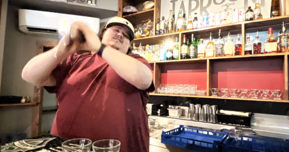 Bryce Romero, proprietor of The Tap Room — 103 East Wishkah St., in Aberdeen — shakes a couple of drinks Tuesday early afternoon for thirsty customers. Romero often uses those skills to make the Green Tea shot, and hand-crafted cocktails. While Romero isn’t sure where the Jameson-based drink came from, he said his place is in the running for the best one in town. (Matthew N. Wells / The Daily World)