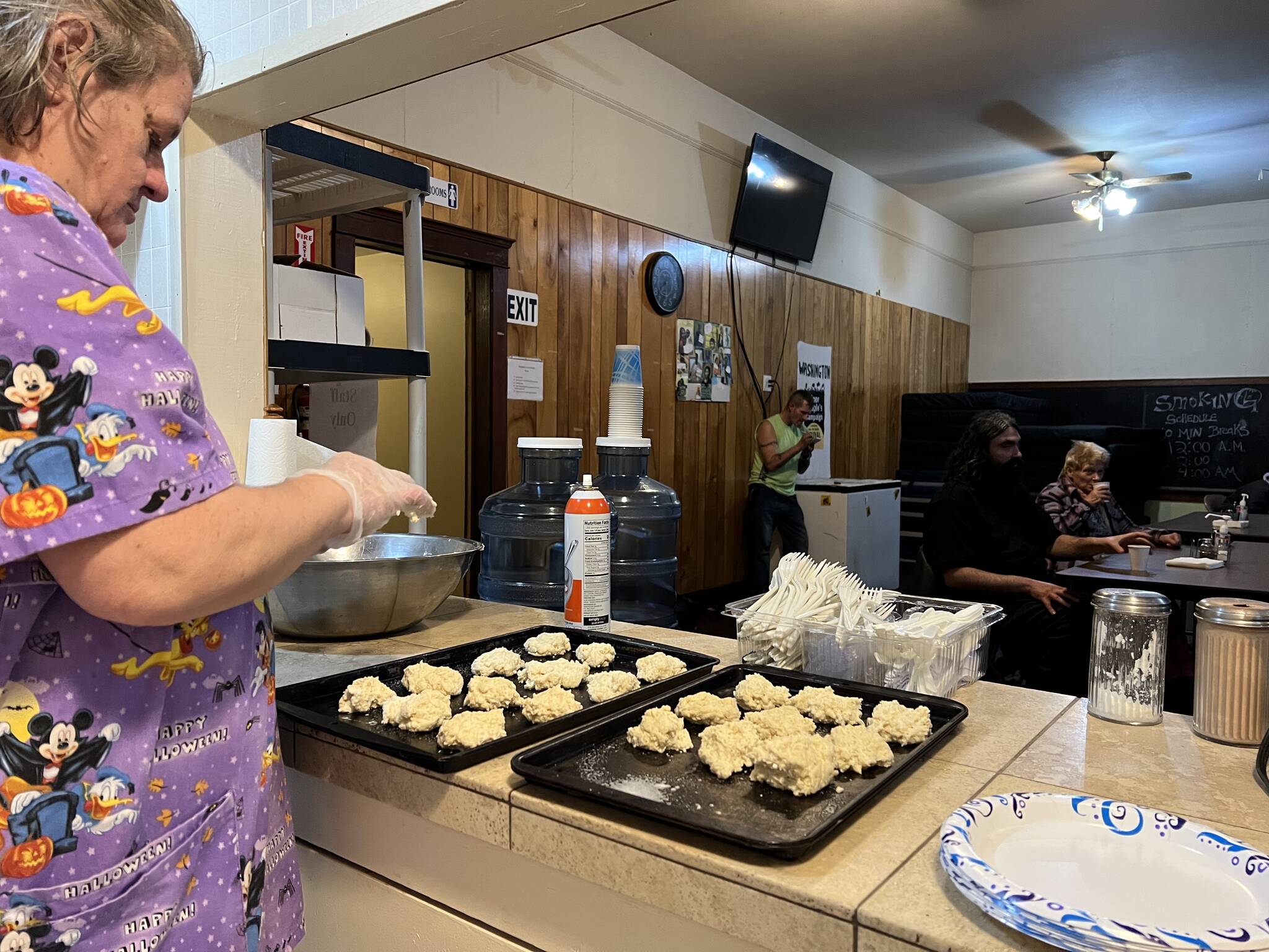 Clayton Franke / The Daily World
Janet, a Chaplains on the Harbor employee, prepares dinner Monday evening at the cold weather shelter in Westport.