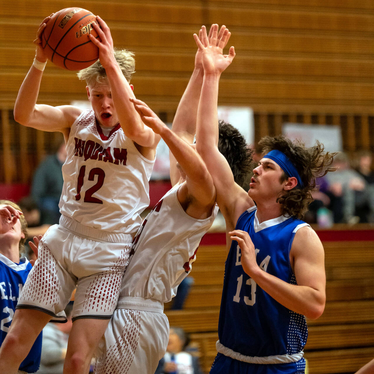 PHOTO BY FOREST WORGUM Hoquiam’s Michael Lorton Watkins (12) grabs a rebound against Elma’s Gibson Cain during the Grizzlies’ 60-51 win on Friday at Hoquiam Square Garden.