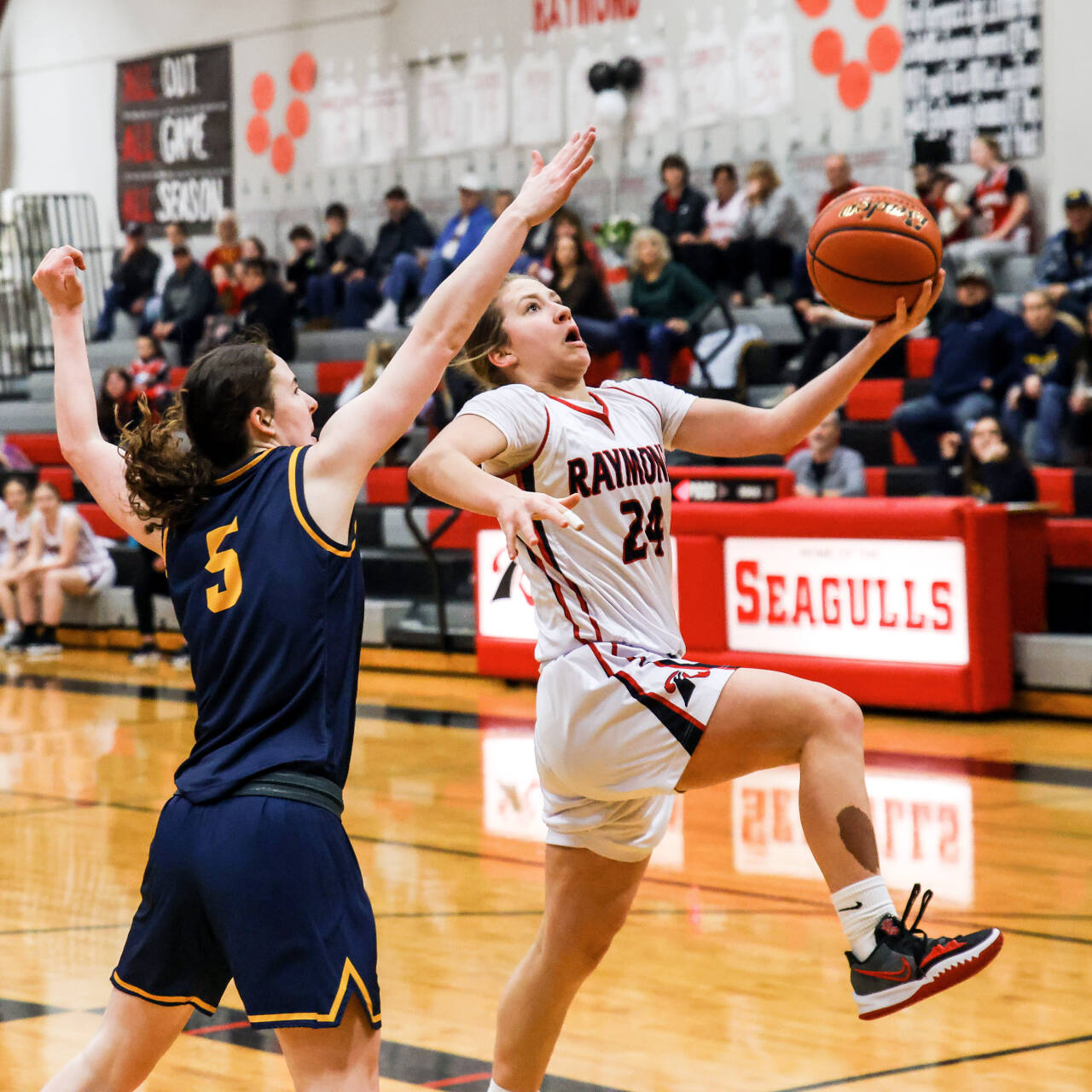 PHOTO BY LARRY BALE Raymond’s Karsyn Freeman (24) drives to the basket against Forks’ Kiera Johnson during the Seagulls’ 64-41 win on Tuesday at Raymond High School.