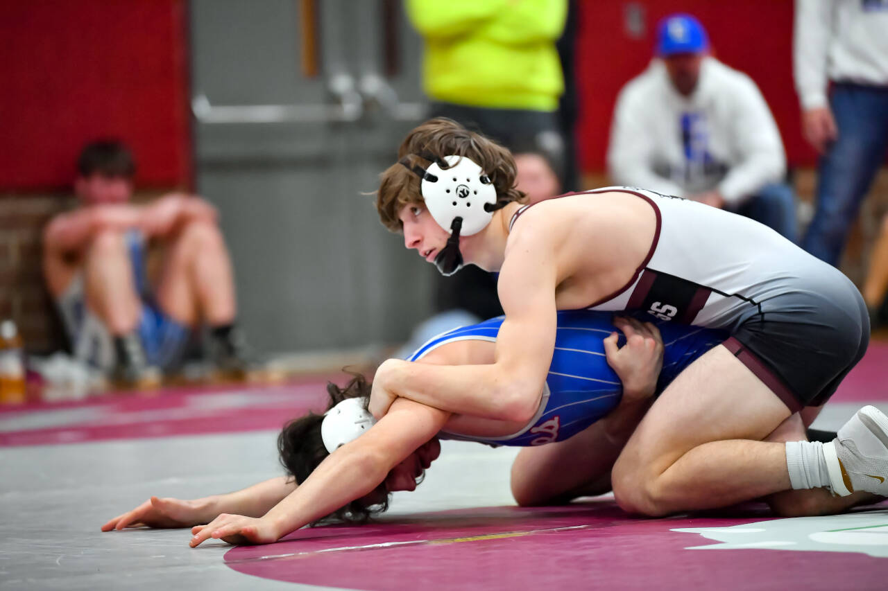 JIM THRALL | MATFOCUS.COM Montesano’s Cole Ekerson, top, competes during a 1A Evergreen duals meet on Saturday in Montesano. Ekerson passed 100 wins for his prep career during the event.