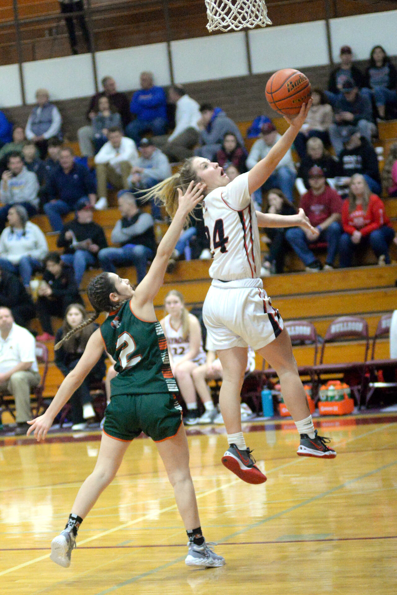 RYAN SPARKS | THE DAILY WORLD Raymond sophomore Karsyn Freeman (24) glides to the basket against Morton-White Pass defender Malia Armstrong during the Seagulls’ 60-41 first-round victory in the 2B District 4 Tournament on Saturday at Montesano High School.