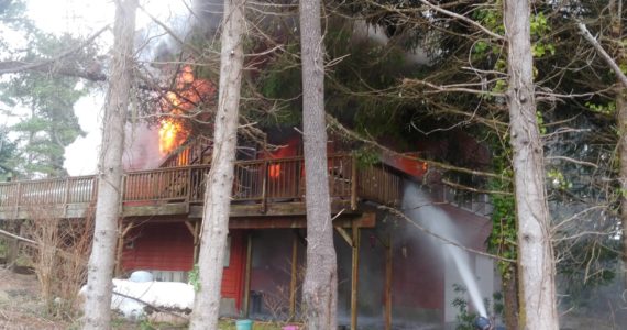 Courtesy photo / SBRFA
Firefighters from the South Beach Regional Fire Authority attack a structure fire in Westport on Feb. 9.