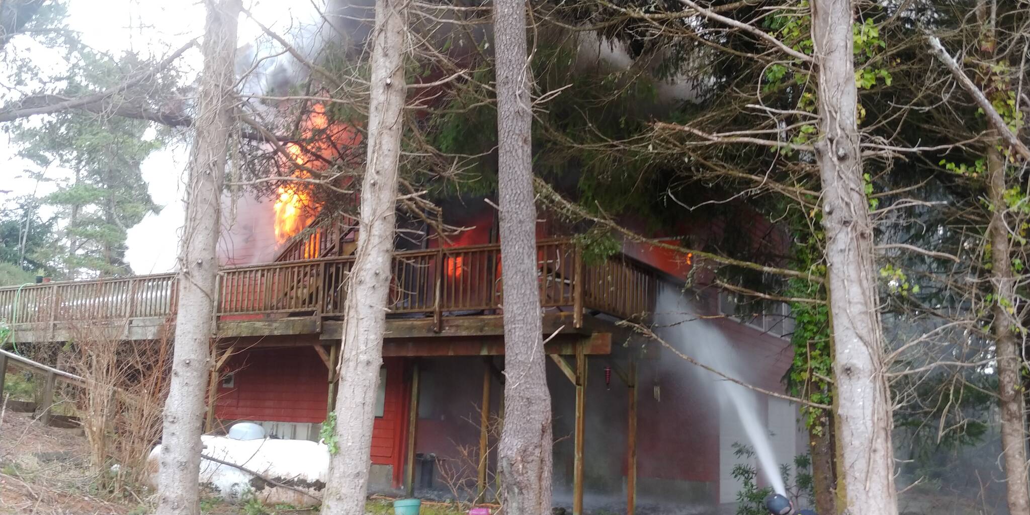 Firefighters from the South Beach Regional Fire Authority attack a structure fire in Westport on Feb. 9. (Courtesy photo / SBRFA)