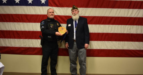 Courtesy of Ocean Shores VFW
Sgt. Chris Iversen receives “Police Officer of the Year” award Monday from Ocean Shores VFW Post 8956 Commander Sam Nation.