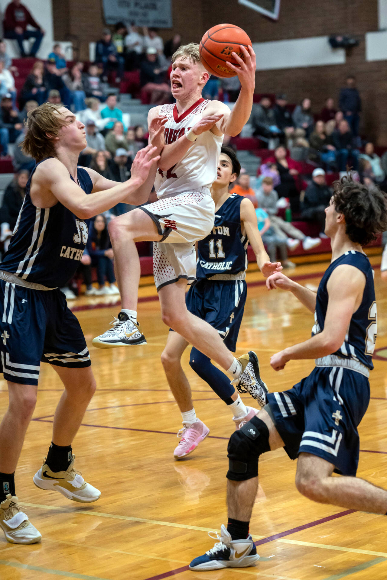 PHOTO BY FOREST WORGUM Hoquiam senior guard Micael Lorton Watkins attacks the Seton Catholic defense during a 63-45 loss in a 1A District 4 Tournament elimination game on Thursday in Montesano.