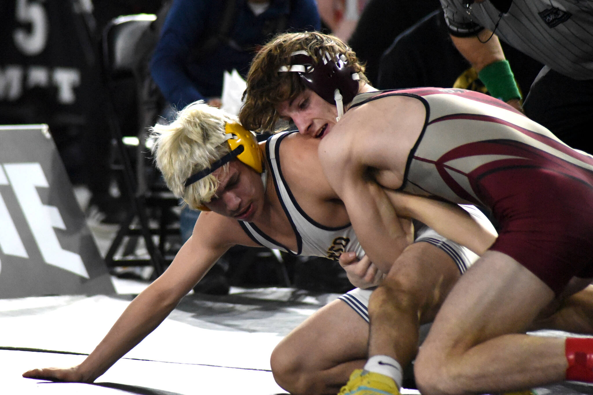 PHOTO BY SUE MICHALAK BUDSBERG Montesano senior Cole Ekerson, right, grapples with Wapato’s Raul Sanchez in a 1A 132-pound semifinal match at the Mat Classic XXXIV state-championship tournament on Saturday at the Tacoma Dome.