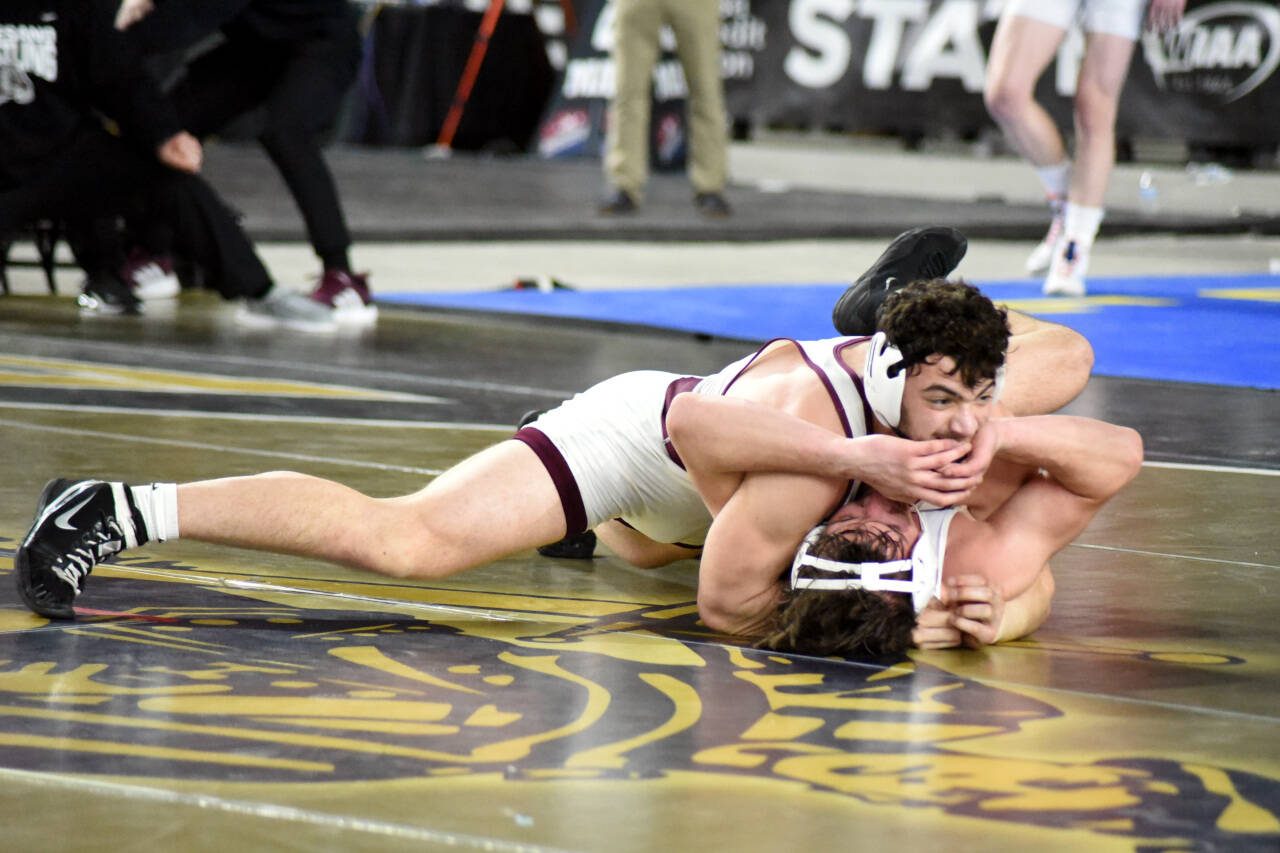 PHOTO BY SUE MICHALAK BUDSBERG 
Montesano’s Mateo Sanchez, top, controls Toppenish’s Kaiden Kintner during the 1A 182-pound championship match at the Mat Classic XXXIV state-wrestling tournament on Saturday in Tacoma.