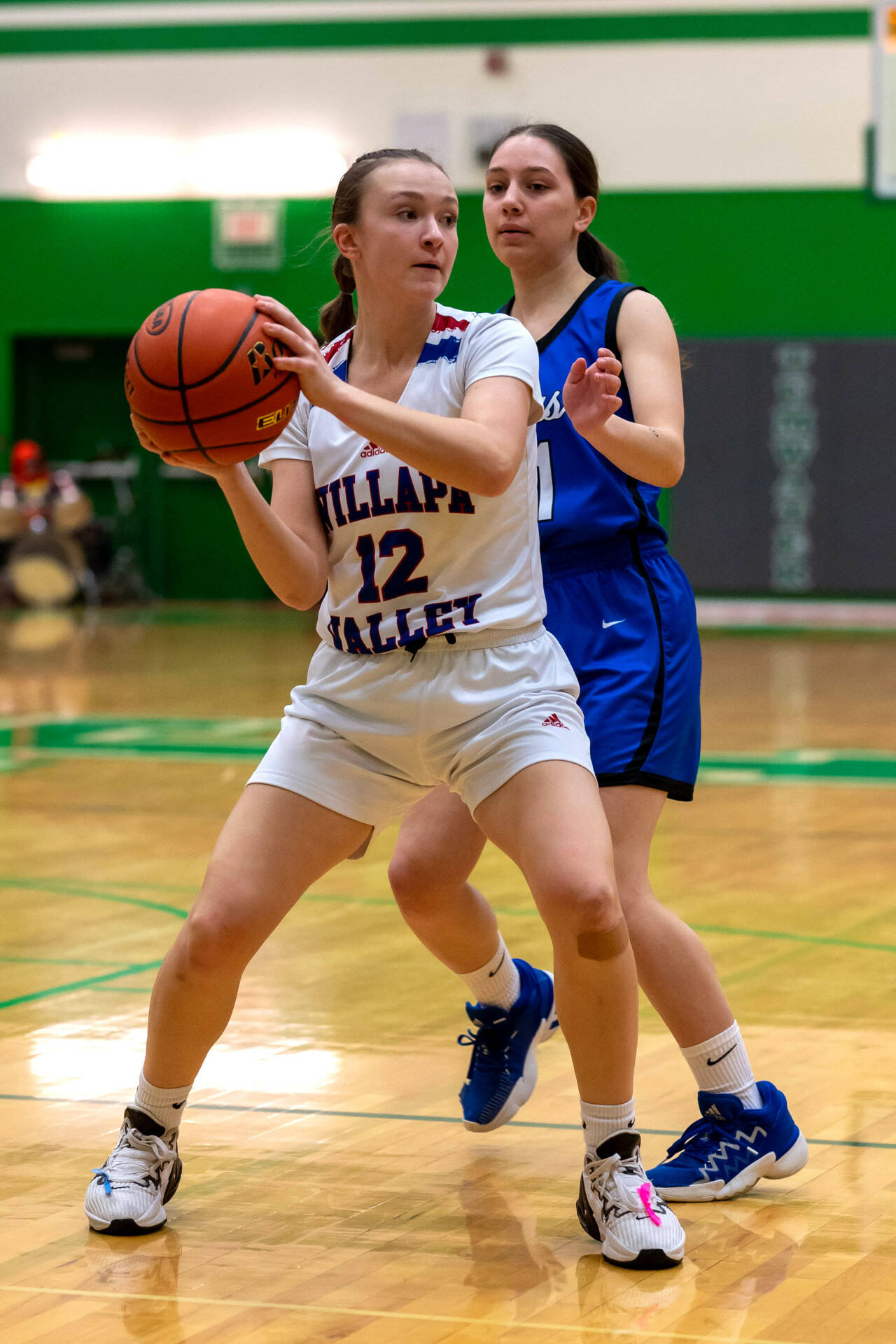 PHOTO BY FOREST WORGUM Willapa Valley freshman Lauren Matlock (12) looks to pass during the Vikings’ 51-30 victory over Orcas Island in a 1B State playoff game on Saturday in Tumwater.