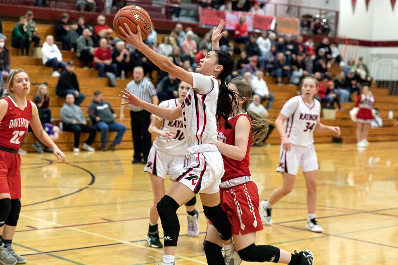 ALEC DIETZ | THE CHRONICLE Raymond guard Megan Kongbouakhay scores on a layup against Davenport in the first round of the Gulls’ 50-42 victory over Davenport in the 2B State Tournament at W.F. West on Saturday.