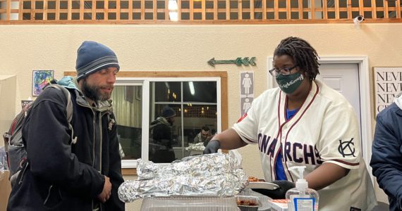 Clayton Franke / The Daily World
Tanikka Watford, executive director of The Moore Wright Group, provides a meal at the group’s warming shelter in the old Swanson’s building in Aberdeen on Tuesday night.