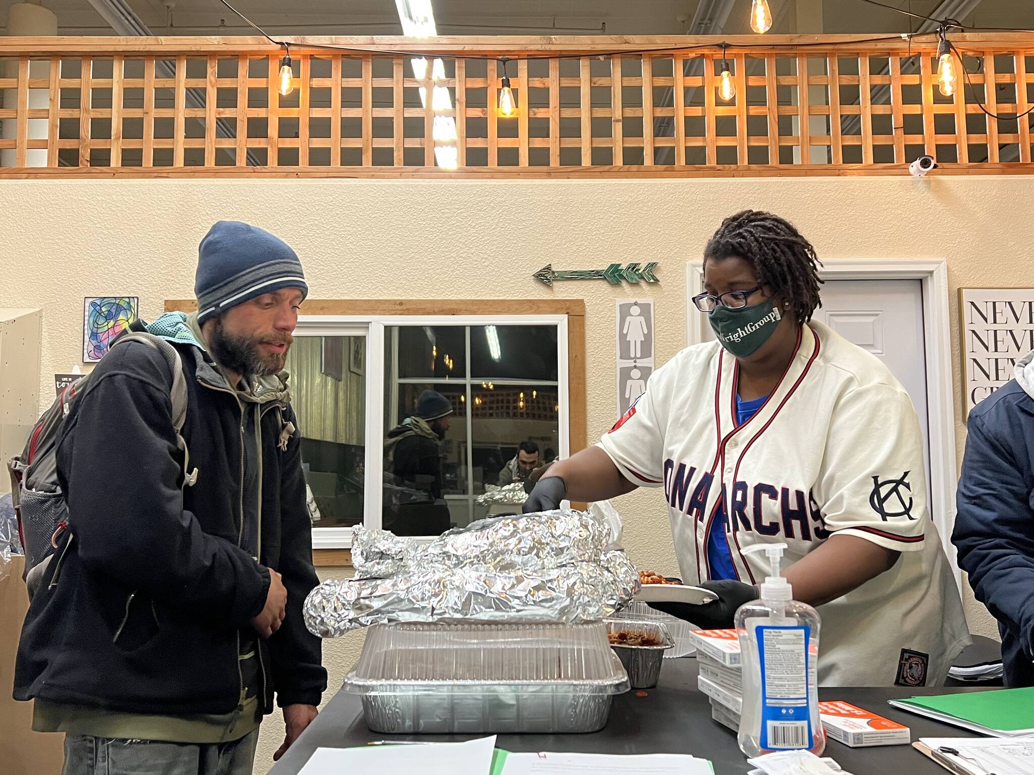 Clayton Franke / The Daily World
Tanikka Watford, executive director of The Moore Wright Group, provides a meal at the group’s warming shelter in the old Swanson’s building in Aberdeen on Tuesday night.