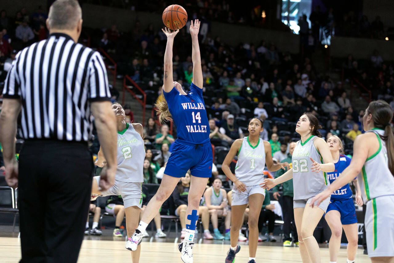 ALEC DIETZ | THE CHRONICLE Willapa Valley forward Grace Huber takes a off-balance shot against Inchelium in the 1B State Tournament Round of 12 at the Spokane Arena on Wednesday.
