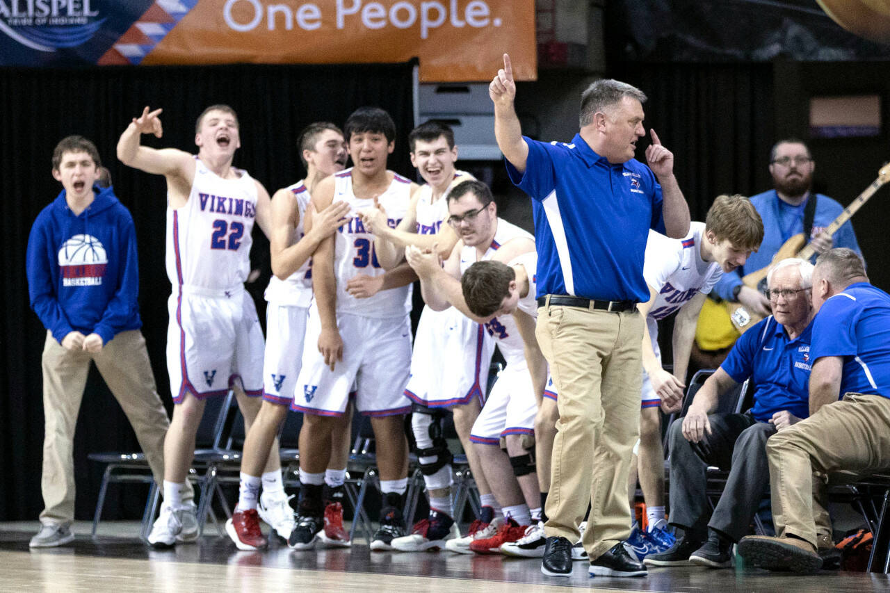 ALEC DIETZ | THE CHRONICLE The Willapa Valley bench celebrates after a 3-pointer against Mossyrock in the 2B state quarterfinals on Thursday at the Spokane Arena.