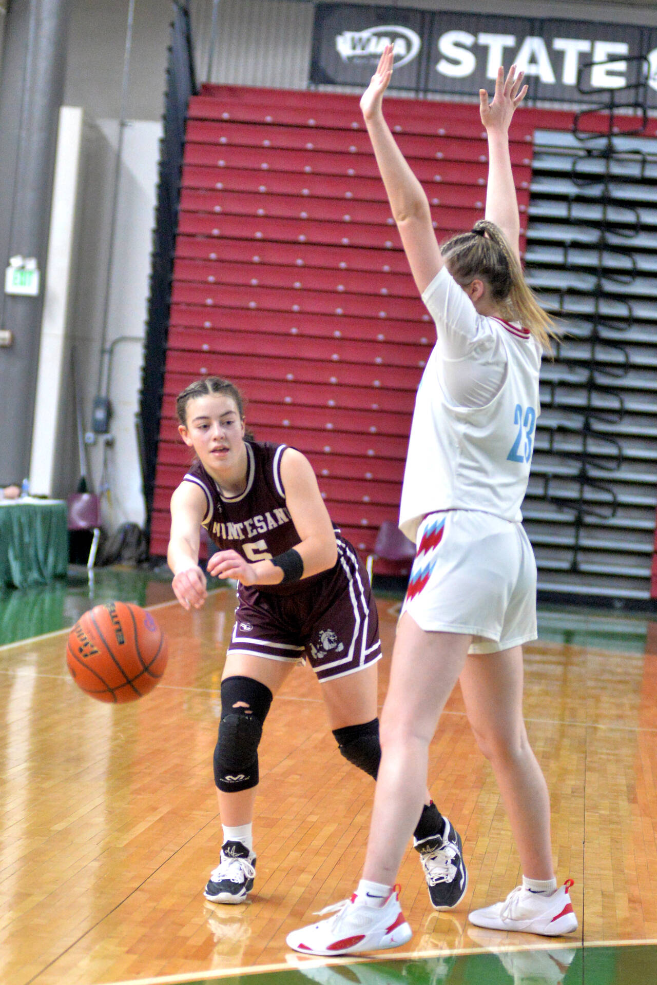 RYAN SPARKS | THE DAILY WORLD Montesano senior Jaiden King (5) passes around Freeman’s JC Goldsmith during the Bulldogs’ 49-68 loss in a 49-38 loss in a 1A State consolation-round game on Friday at the Yakima Valley SunDome.