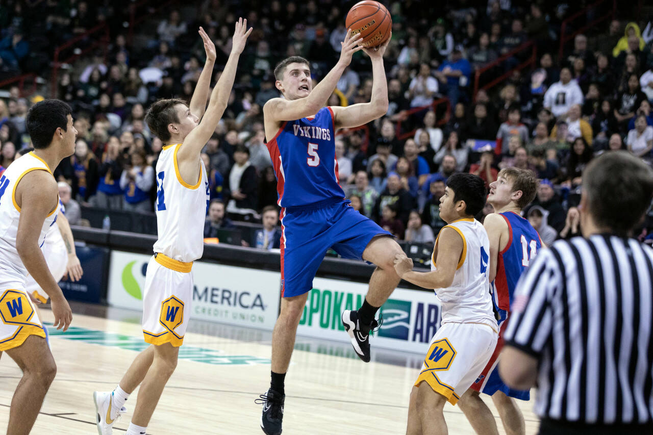 ALEC DIETZ | THE CHRONICLE Willapa Valley forward Wil Clements rises for a shot against Wellpinit in the 1B State semifinals at Spokane Arena on Friday.