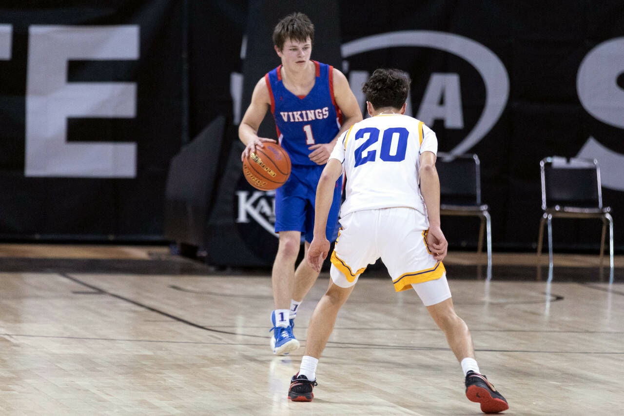 ALEC DIETZ | THE CHRONICLE Willapa Valley guard Kolten Fluke takes the ball up the floor against Wellpinit in the 1B State semifinals at Spokane Arena on Friday.