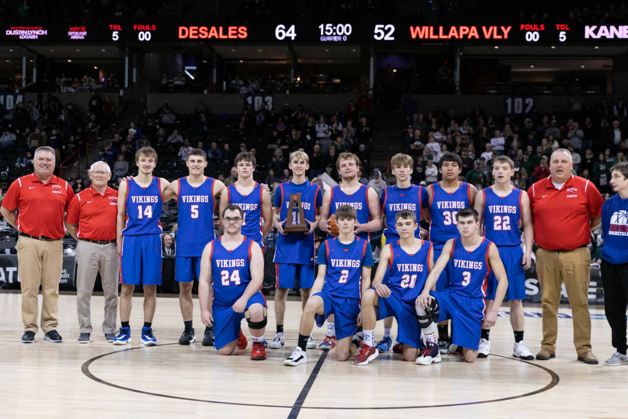 ALEC DIETZ | THE CHRONICLE The Willapa Valley boys basketball team poses with the fifth-place trophy after losing to DeSales 64-52 on Saturday in the 1B 3rd/5th-place game at the Spokane Arena.