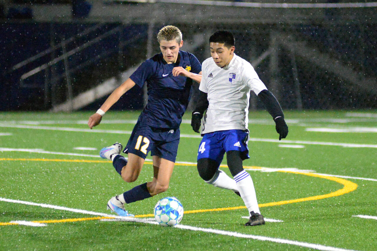 RYAN SPARKS | THE DAILY WORLD Aberdeen’s Colby Mendoza (12) and Elma’s Gregory Mendez joust for possession during the Bobcats’ 3-0 win on Monday at Stewart Field in Aberdeen.