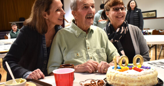 Matthew N. Wells / The Daily World 
Rudy Spanich and his daughters, from left, Debbie Ramstad and Kathy Wise, celebrate Spanich’s 100th birthday. Spanich turned 100 on Sunday since he was reminded he was “100 and two days old,” on Tuesday. The family, along with at least 100 Hoquiam Lions Club members, celebrated Spanich’s centennial and the 65 years he’s spent as a Hoquiam Lion at Hoquiam Elks Lodge.