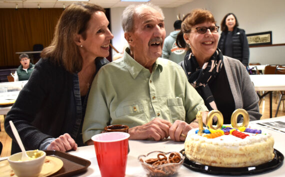 Matthew N. Wells / The Daily World 
Rudy Spanich and his daughters, from left, Debbie Ramstad and Kathy Wise, celebrate Spanich’s 100th birthday. Spanich turned 100 on Sunday since he was reminded he was “100 and two days old,” on Tuesday. The family, along with at least 100 Hoquiam Lions Club members, celebrated Spanich’s centennial and the 65 years he’s spent as a Hoquiam Lion at Hoquiam Elks Lodge.