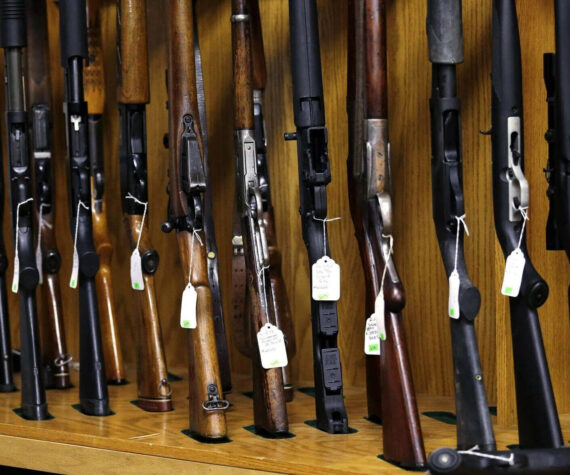 Elaine Thompson / AP
In this Oct. 20, 2017 photo, rifles are lined up and ready to be auctioned at Johnny’s Auction House, where the company handles gun sales for about a half dozen police departments and the Lewis County Sheriff’s Office, in Rochester.