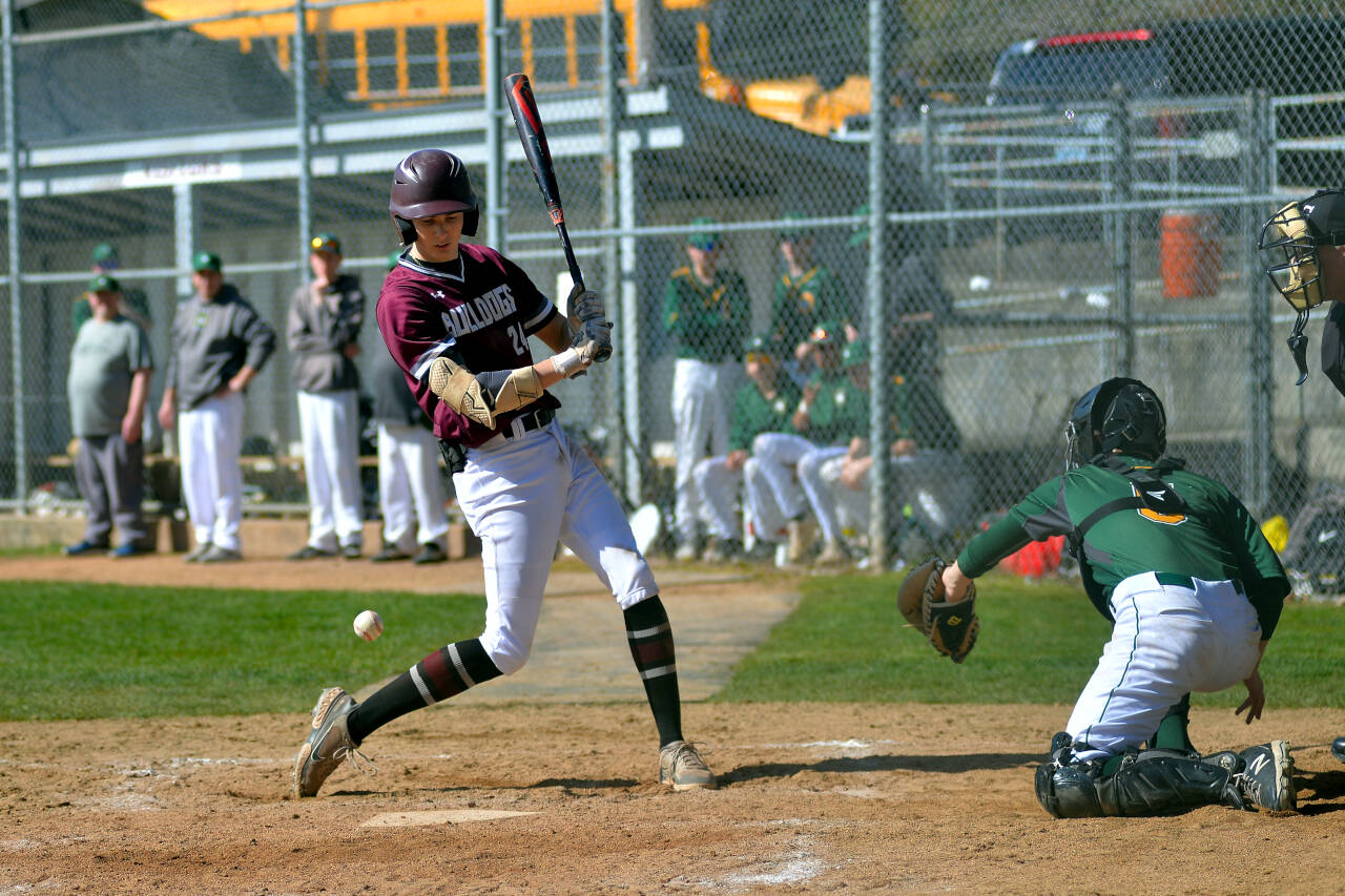 RYAN SPARKS | THE DAILY WORLD Montesano’s Bode Poler is hit by a pitch during the Bulldogs’ 6-3 victory against Overlake on Saturday at Vessey Field in Montesano.