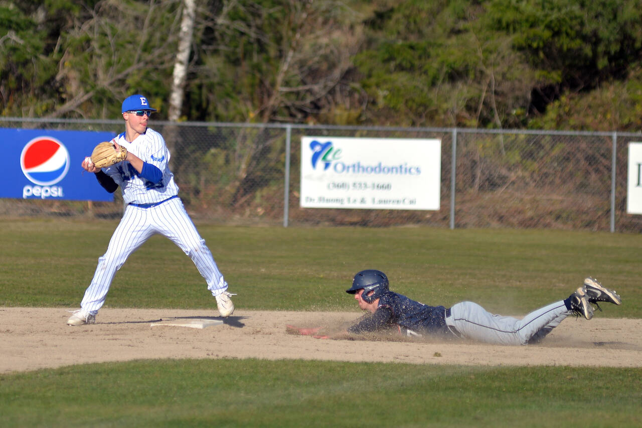 RYAN SPARKS | THE DAILY WORLD Elma infielder Blake Corr, left, turns a double play during Elma’s 8-4 victory over Black Hills on Wednesday in Elma.