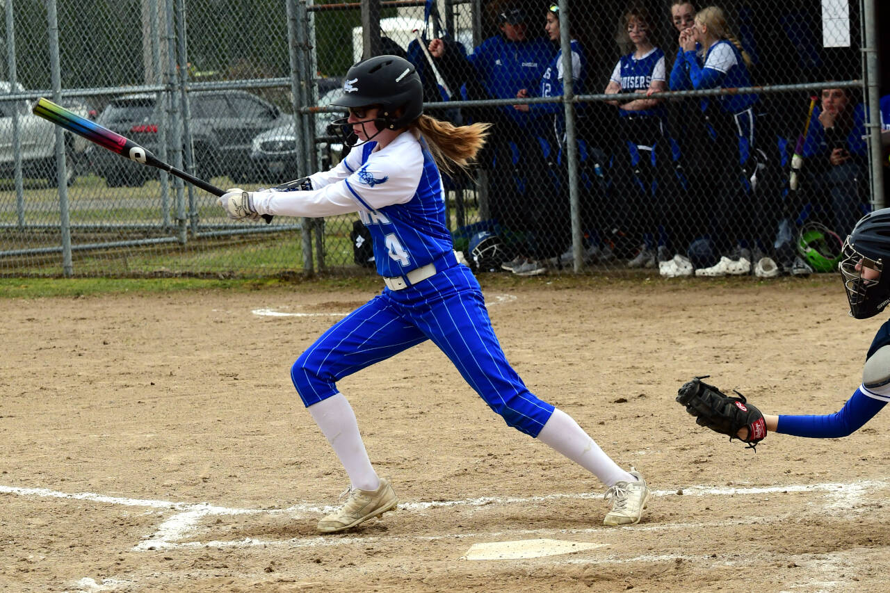 PHOTO BY CHRYSTAL WELD Elma’s Chloe Donais puts the ball in play during the Eagles’ 15-2 victory over Eatonville on Wednesday in Elma.