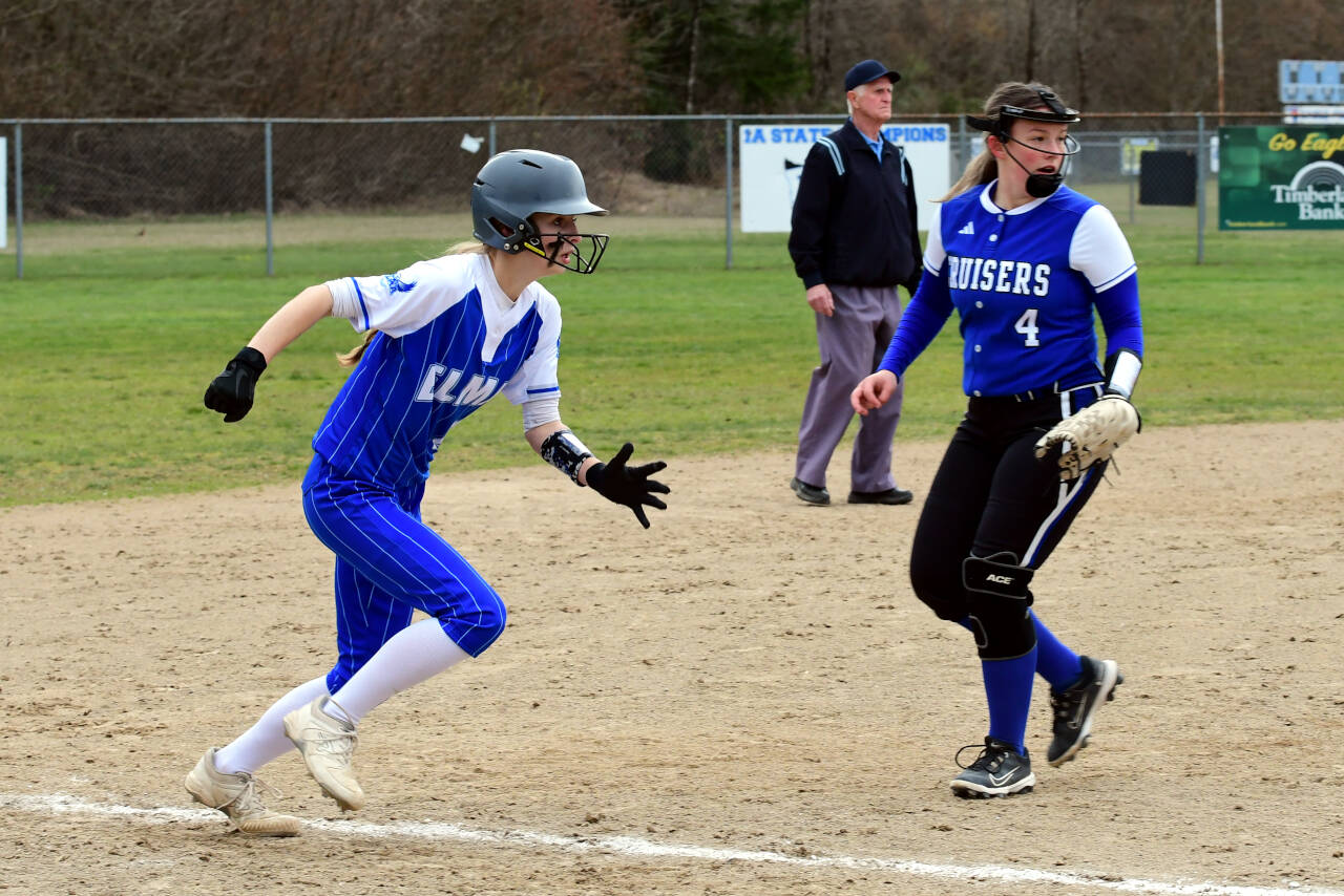 PHOTO BY CHRYSTAL WELD Elma’s Aaleigha Weld, left, races home during the Eagles’ 15-2 victory over Eatonville on Wednesday in Elma.