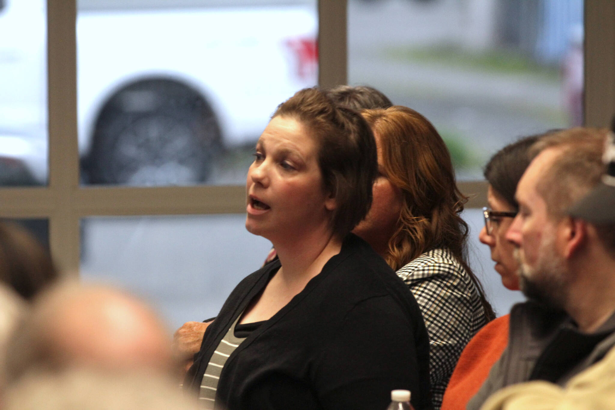 Katie Judd asks a question to leadership of the local fire departments during a meeting about the proposed creation of a regional fire authority for Central Grays Harbor on March 28. (Michael S. Lockett / The Daily World)