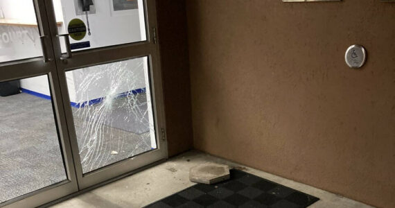 Courtesy photo / APD
A stepping stone used to break the window of the Aberdeen Police Department’s sliding door is visible on the ground after the incident.