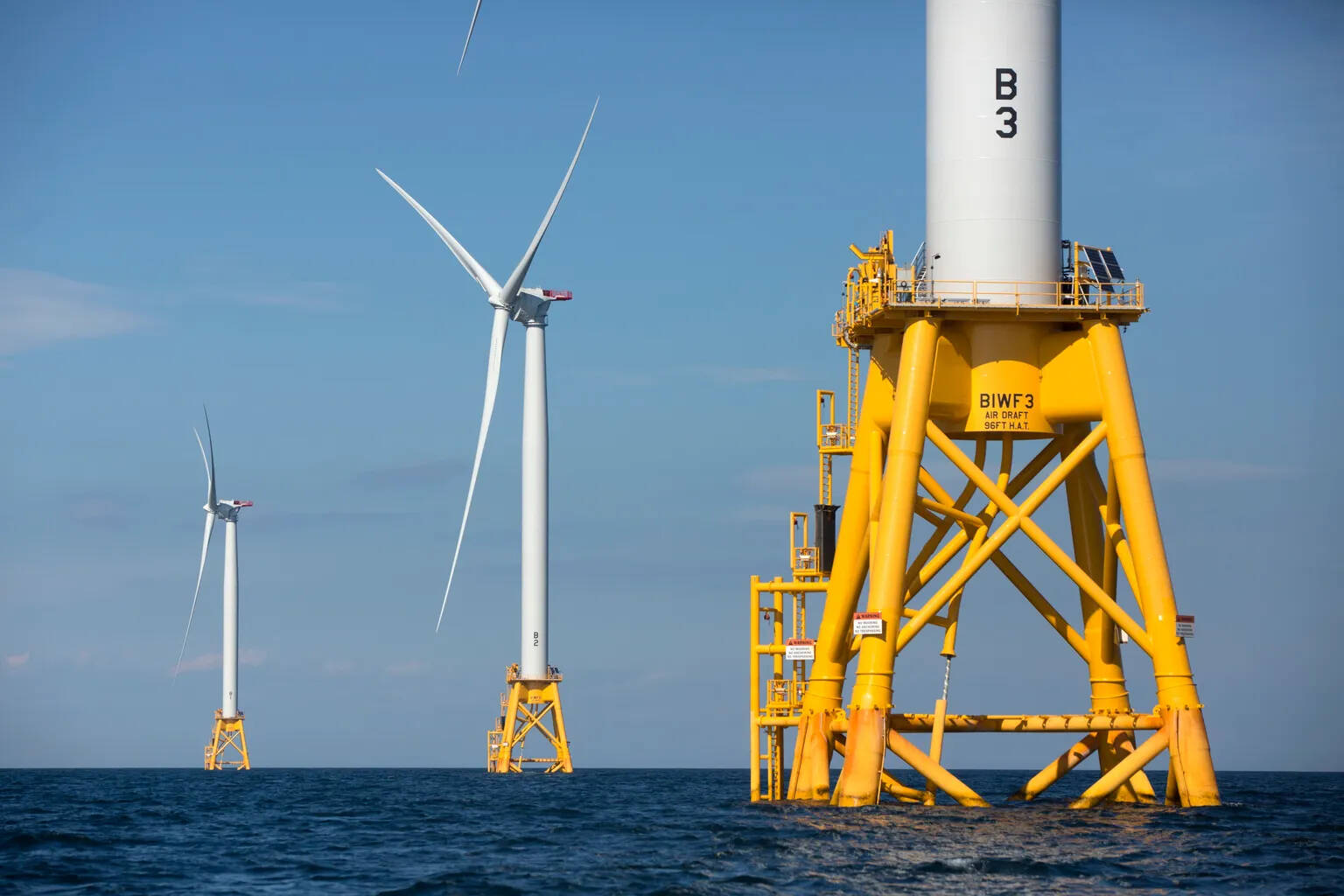 Three turbines stand in the water off Block Island, Rhode Island, in 2016, the nation’s first offshore wind farm. (The Seattle Times file photo)