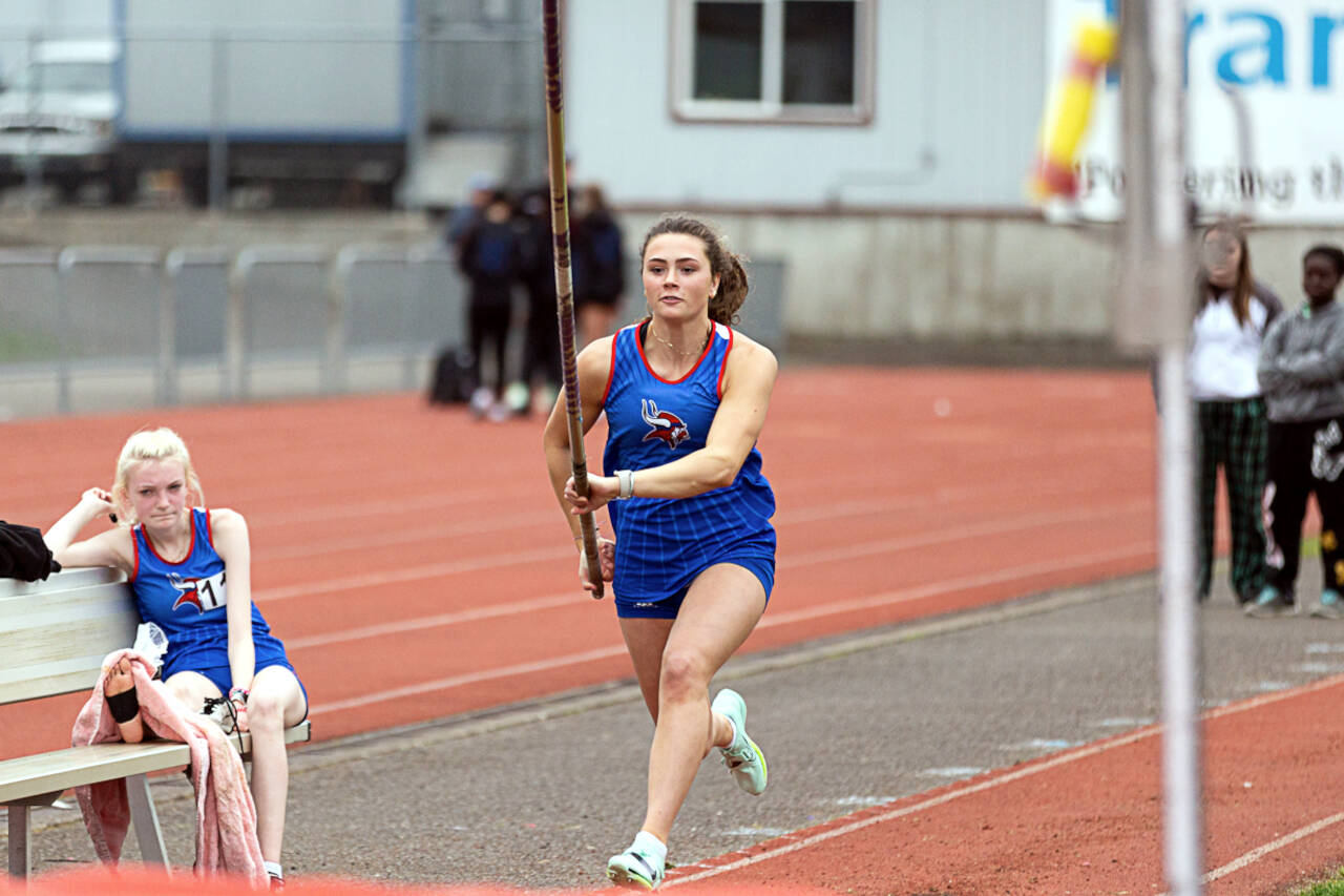 ALEC DIETZ | THE CHRONICLE Willapa Valley’s Lauryn McGough runs along the runway before a pole vault attempt at the Chehalis Activators Classic on Saturday at W.F. West High School. McGough would go on to win the event.