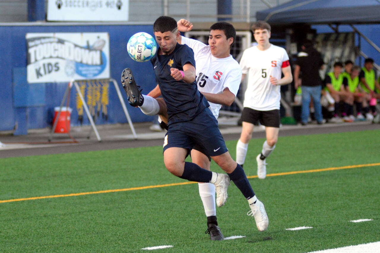 RYAN SPARKS | THE DAILY WORLD Aberdeen’s Elmer Torres, left, draws a foul against Shelton’s Joel Hernandez-Zarrage Jr. during the Bobcats’ 6-0 win on Friday in Aberdeen.
