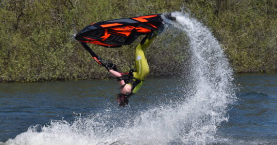 Photos by Clayton Franke / The Daily World
Freestyle jet-skier Tanner Thomas performs a backflip on Vance Creek Pond in Elma on Saturday, April 29, during the halftime show of the PNW Water X racing event.