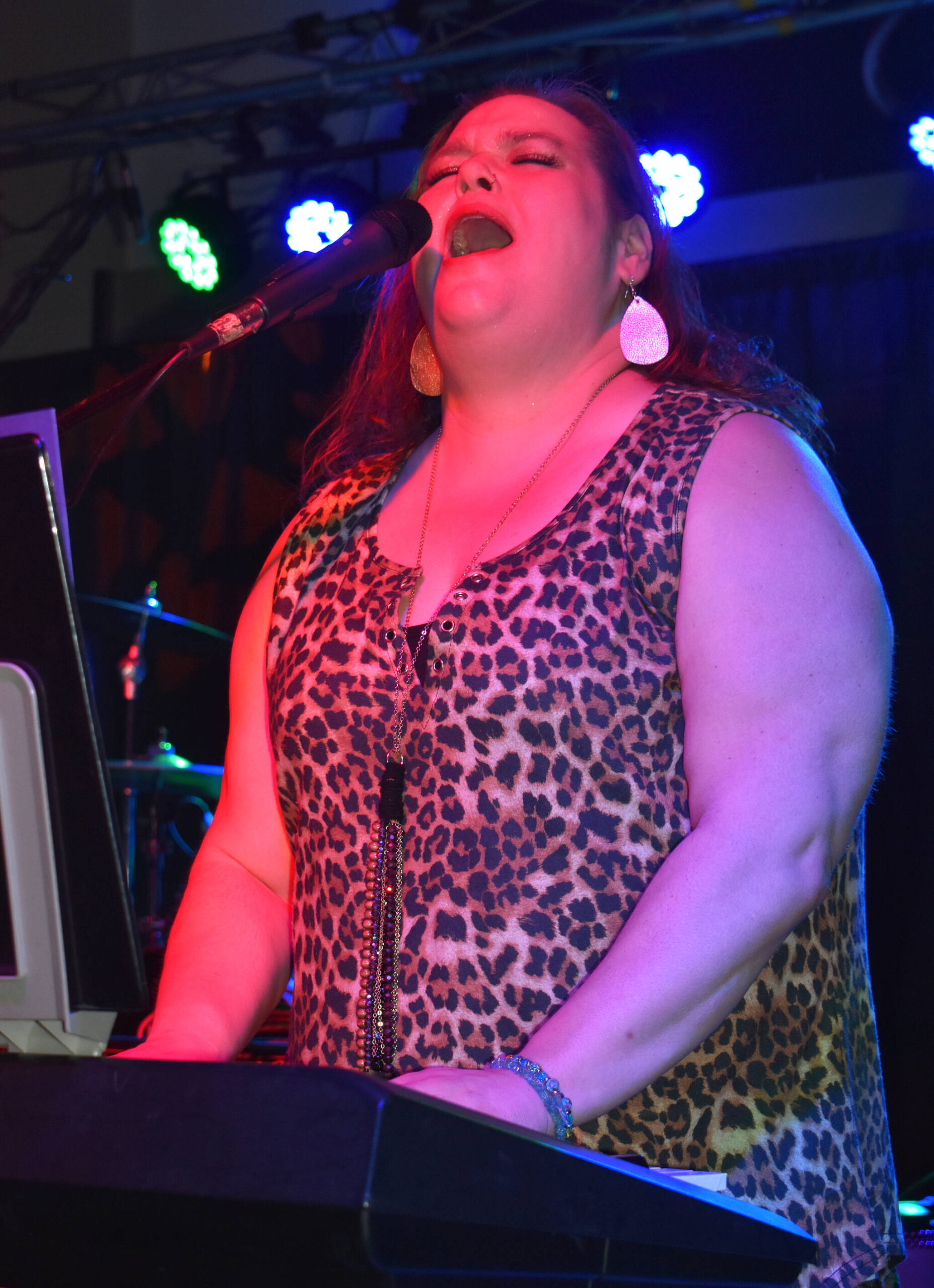 Tiffany Maki, singer and keyboardist for Ms. Maki & Co., belts out a lyric during her band's performance Saturday evening at Celebrate Summer Jam at Ocean Shores Convention Center. Maki made sure the crowd, and her bandmates, know how appreciative she is of the stellar work they did on stage. (Matthew N. Wells / The Daily World)