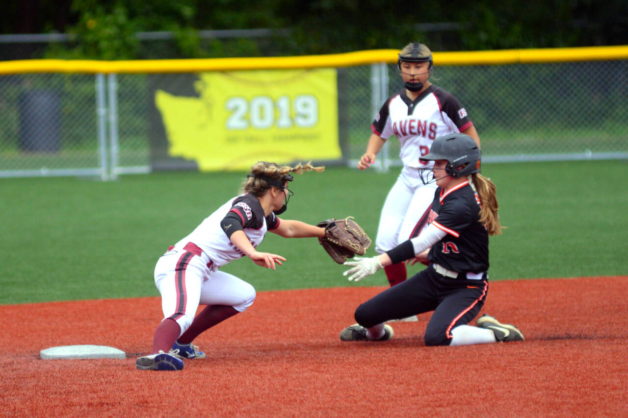 RYAN SPARKS | THE DAILY WORLD Raymond-South Bend shortstop Kyndal Koski, left, tags out Napavine’s Clara Fay during the Ravens’ 12-9 victory in a 2B District 4 Tournament game on Monday in Montesano.