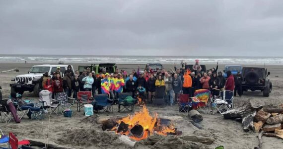 Courtesy photo / Nicole Koch
Participants in last year’s Clean Shores event pose with the traditional bonfire.