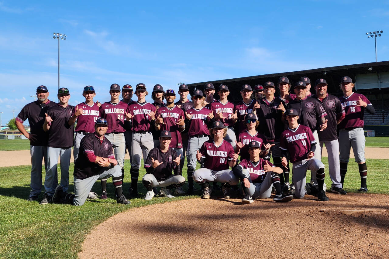 RYAN SPARKS | THE DAILY WORLD The Montesano Bulldogs pose for a photo after a 5-4 victory over Colville in a 1A State Tournament quarterfinal game on Saturday at Olympic Stadium in Hoquiam.