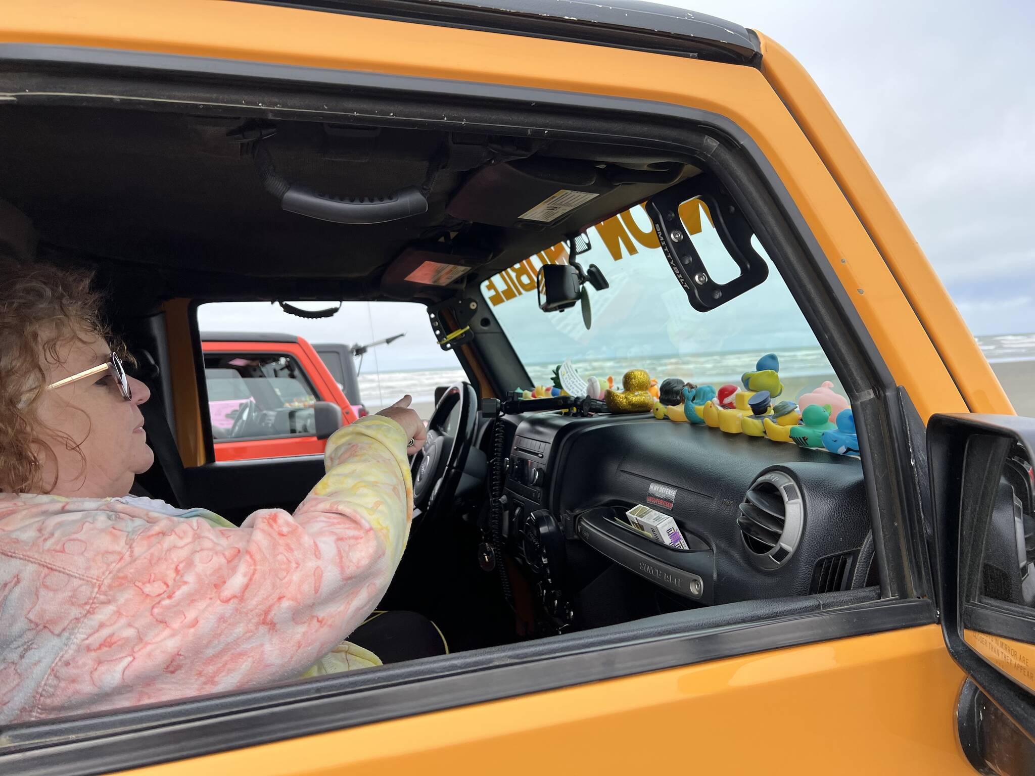 Clayton Franke / The Daily World
Marilyn Stroman sits in her Jeep, named “Dozer the Minion Mobile,” on the beach at Chance A La Mer on Saturday, May 20.