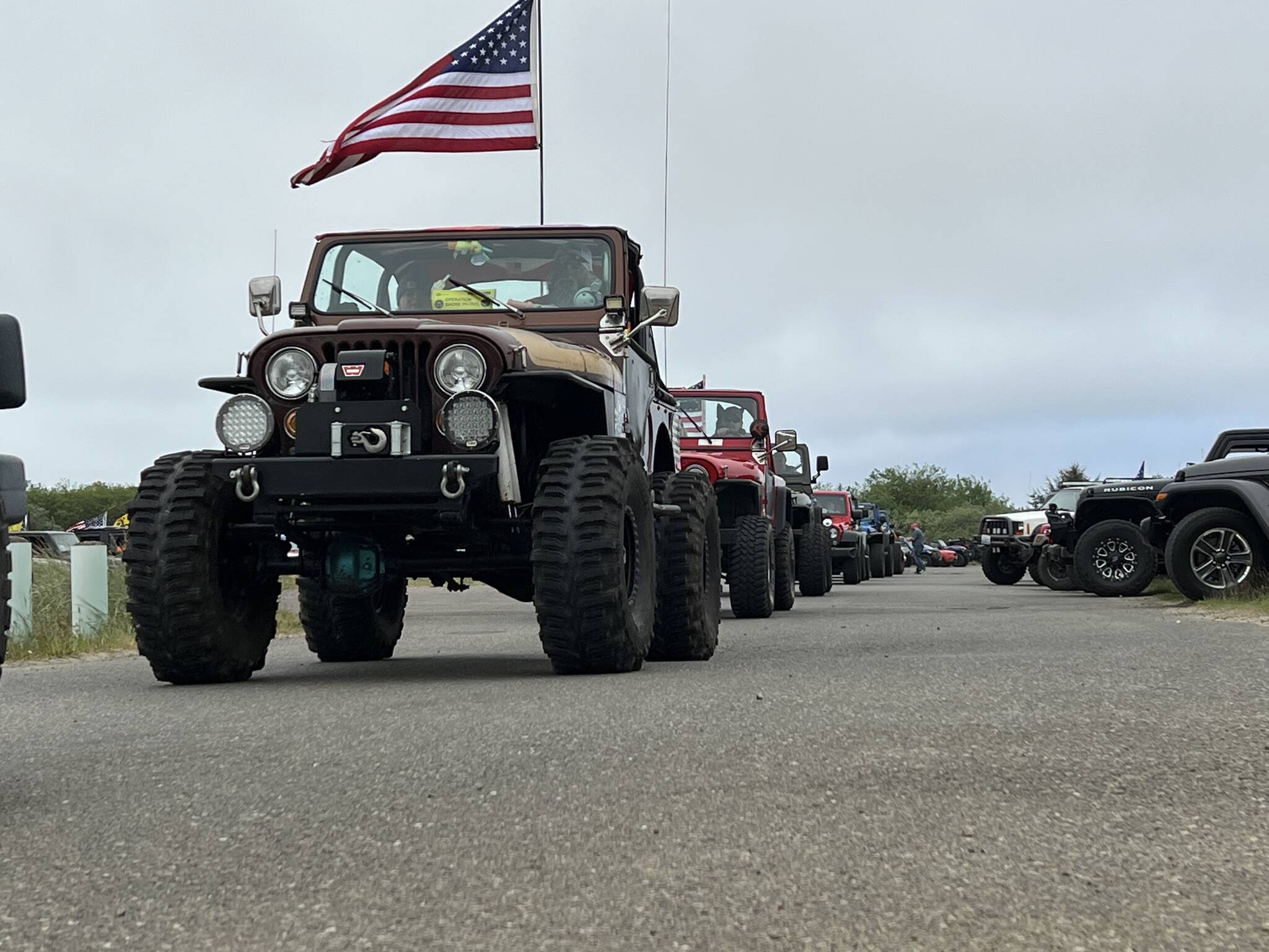 Clayton Franke / The Daily World
A parade of 700 Jeeps leaves the parking lot at Oyhut Bay Seaside Village on Saturday, May 20.